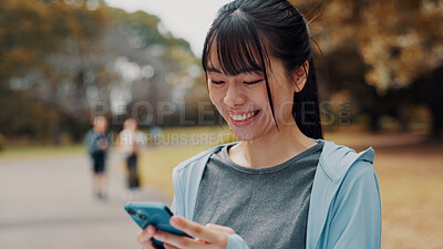 Buy stock photo Smile, woman and typing with phone of fitness outdoor, communication and research of exercise application. Happy, athlete and mobile for gym membership, training schedule and workout routine in Japan