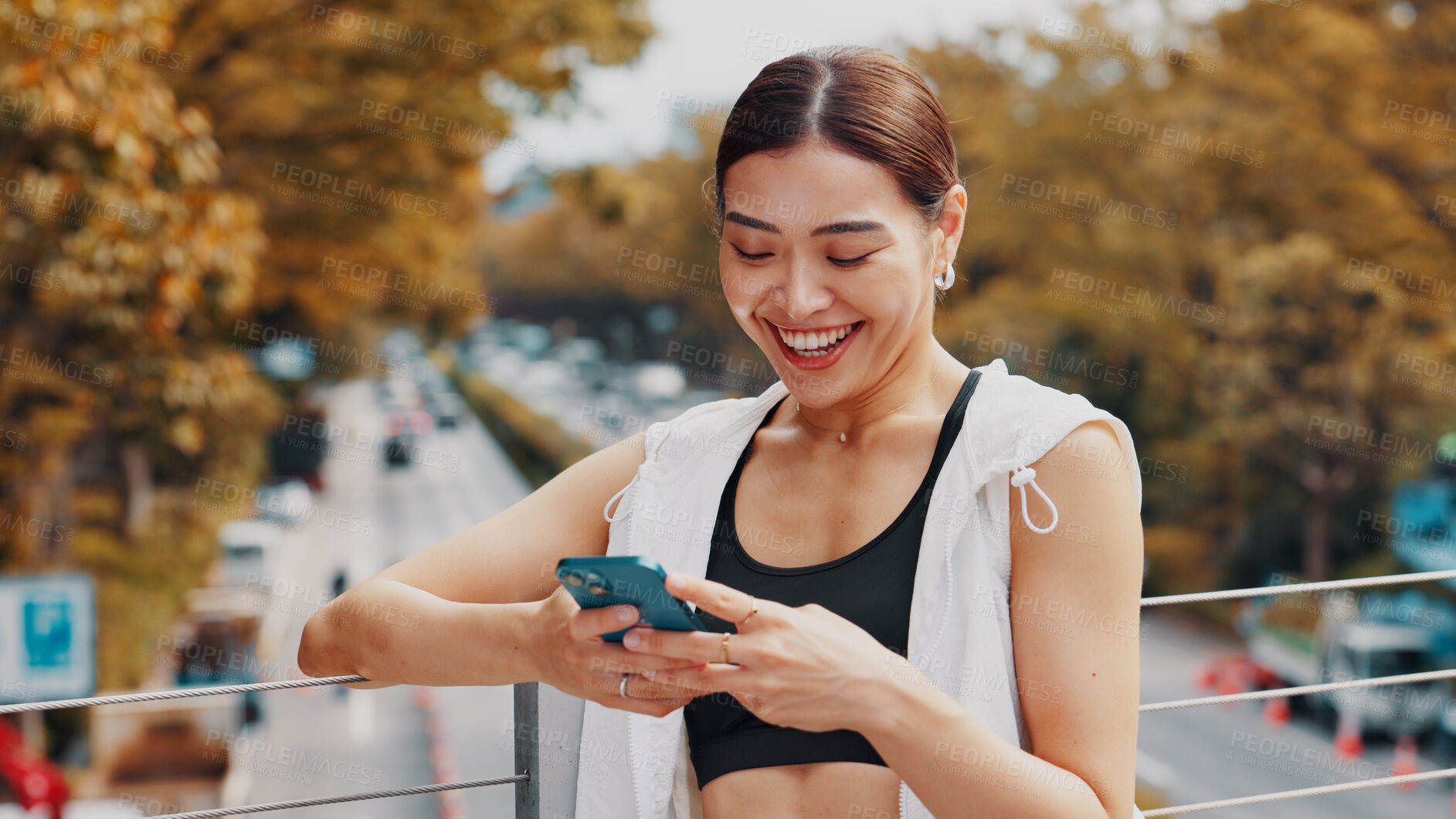 Buy stock photo Woman, laughing and phone of fitness in city, communication and sports application. Happy, female athlete and typing on mobile with social media, funny blog and contact for travel directions in Japan