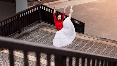 Buy stock photo Woman, stretching and ballet movement in city, outdoor and practice performance for art. Female person, professional dancer and creative talent in Japan, rehearsal and urban town for elegant training