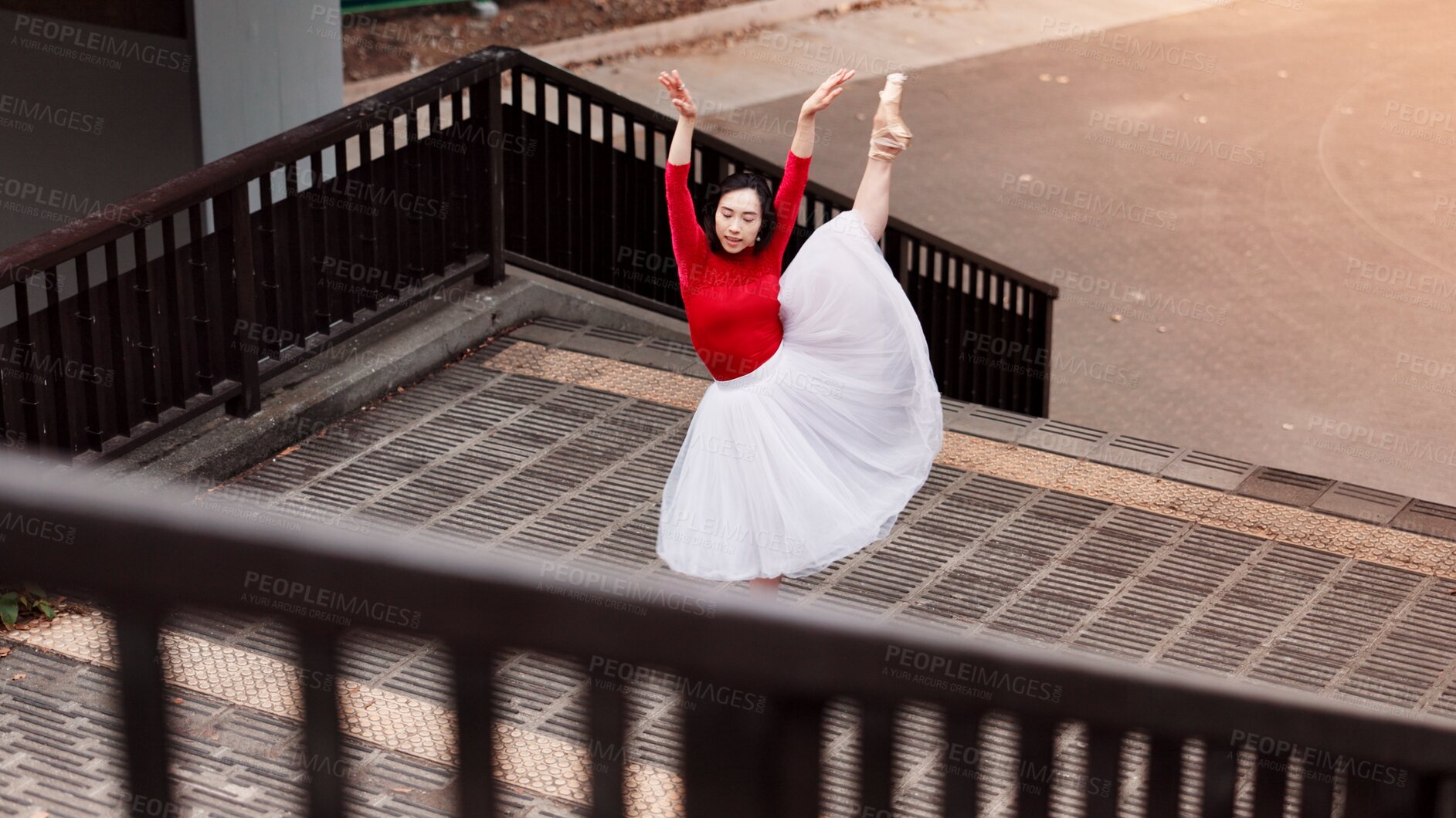 Buy stock photo Woman, stretching and ballet movement in city, outdoor and practice performance for art. Female person, professional dancer and creative talent in Japan, rehearsal and urban town for elegant training