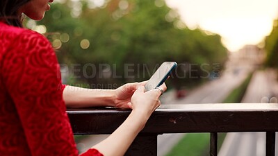 Buy stock photo Hands, phone and texting on bridge, nature and outdoor for notification, chat and mobile app by fence in city. Person, smartphone and scroll in town for contact, internet and social network in Japan