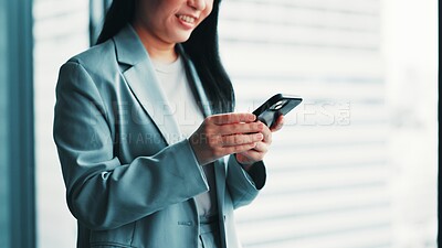 Buy stock photo Woman, phone and smile at window for business, research economy and good news in Japanese company. Finance investor, tech and reading in office for report, stock market update and career opportunity