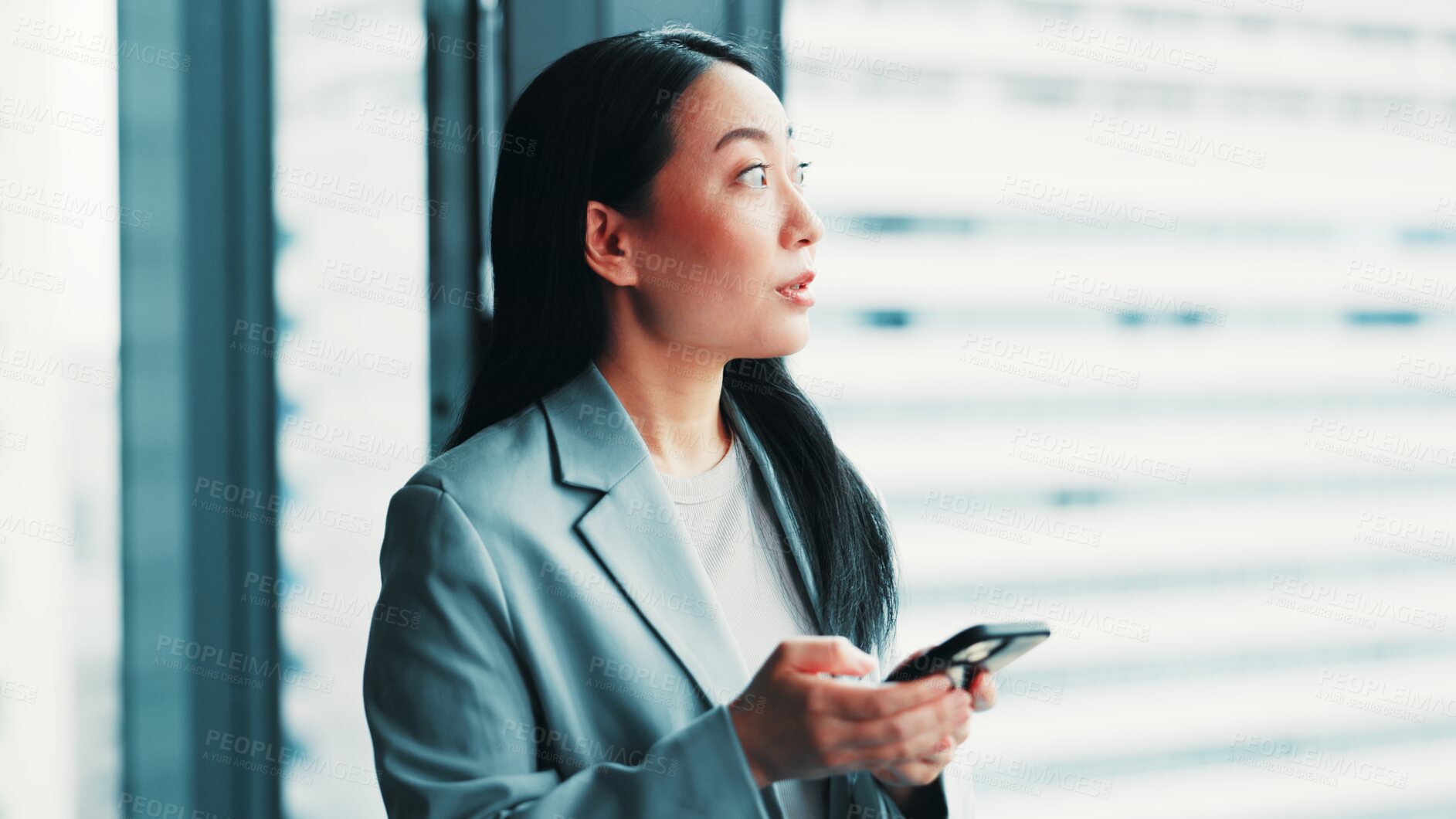 Buy stock photo Woman, phone and thinking at window for business, research economy and review in Japanese company. Finance investor, idea and mobile in office for report, stock market feedback and career development