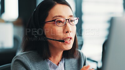 Buy stock photo Woman, computer operator and customer support agent in office, talk and advisor to client on web. Female person, call centre representative and helping consumer with loan in Japan insurance agency