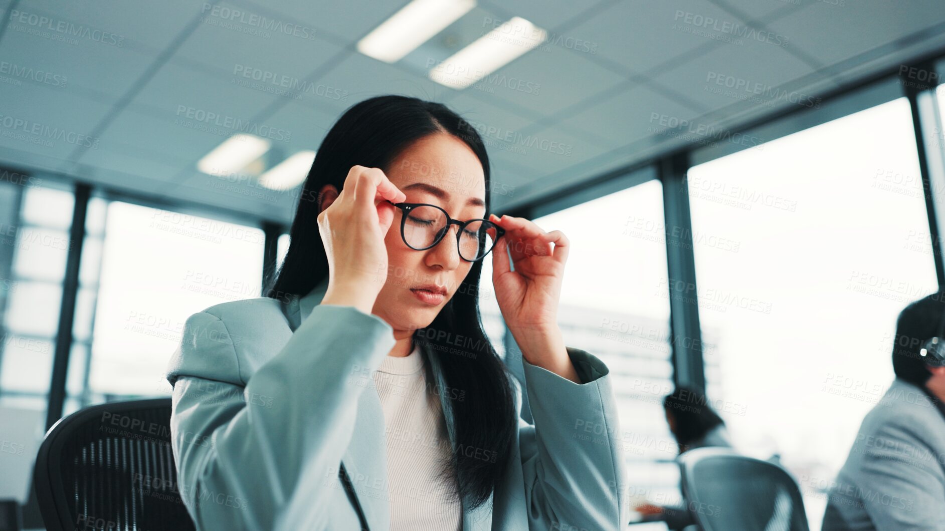 Buy stock photo Tired, glasses and business with Japanese woman in office for fatigue, anxiety and burnout. Frustrated, mistake and fear with female employee in corporate firm for headache, overworked and stress