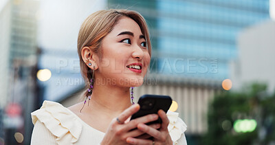 Buy stock photo Thinking, phone and Japanese woman in city on location, street road or holiday adventure journey in Tokyo. Night, travel ideas and happy girl with smile or mobile app for trip, navigation and map