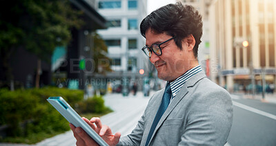 Buy stock photo Japanese man, city street and tablet for direction, location search and navigation with happiness. Male person, technology and smile on sidewalk for commute, travel and walk as real estate developer