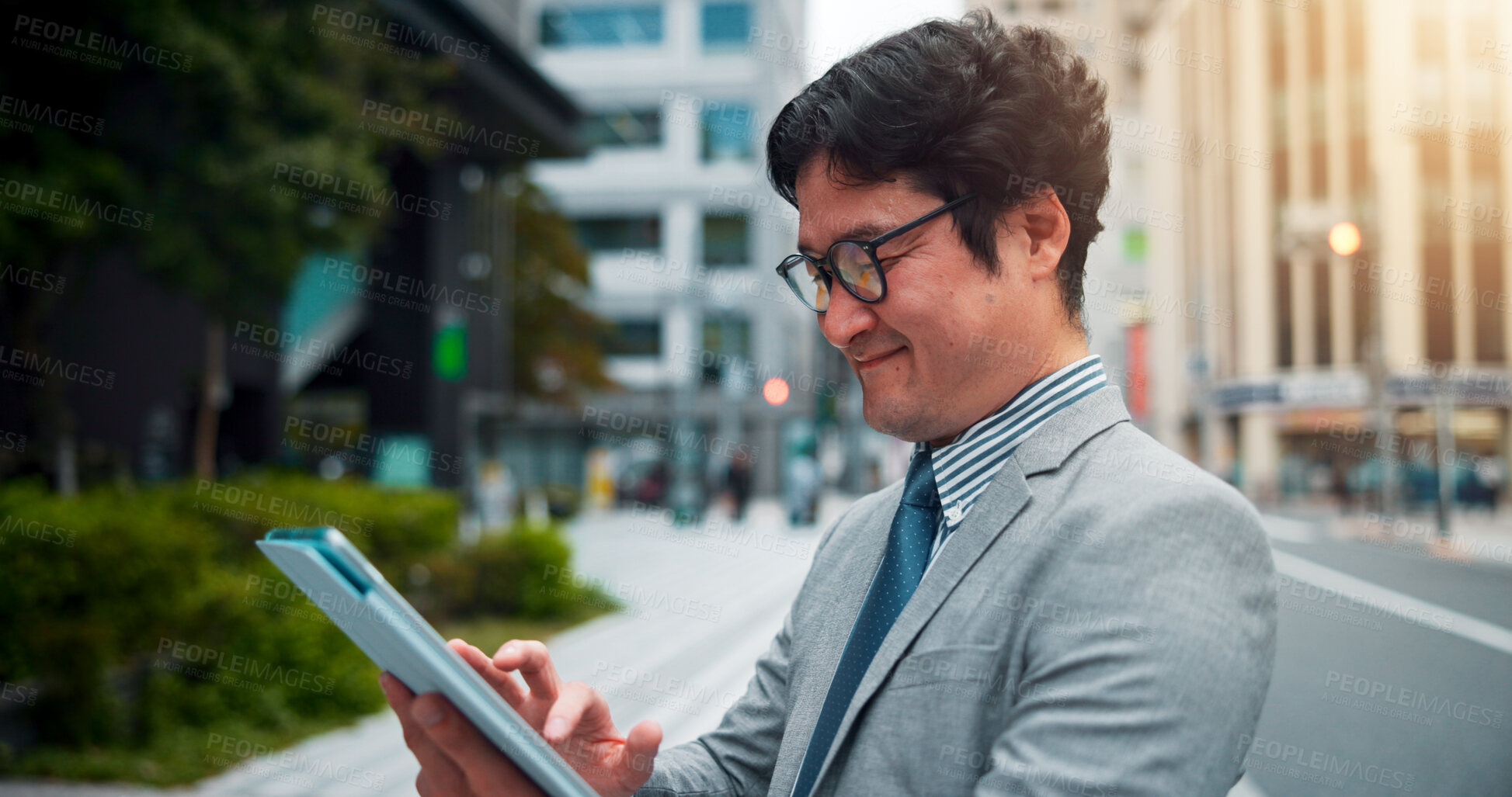 Buy stock photo Japanese man, city street and tablet for direction, location search and navigation with happiness. Male person, technology and smile on sidewalk for commute, travel and walk as real estate developer