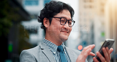 Buy stock photo Business, man and smile with phone in city for internet scroll, location search or mobile app for checking schedule. Japanese person, happy and smartphone in urban town for texting on morning commute