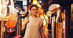Night, street market and Japanese woman in city on vacation for shopping, travel destination and festival. Culture, traditional holiday and walking with person in alley for urban, tourism or heritage