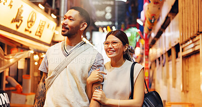 Buy stock photo Couple, night and walking street market in Japan, love and bonding on honeymoon vacation. People, security and outdoor support on holiday in town, travel together and explore culture or sightseeing
