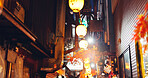 Night, lights and street market in city of japan on vacation for shopping, travel destination or festival. Culture, traditional holiday and lamps with alley in outdoor for urban, tourism and heritage