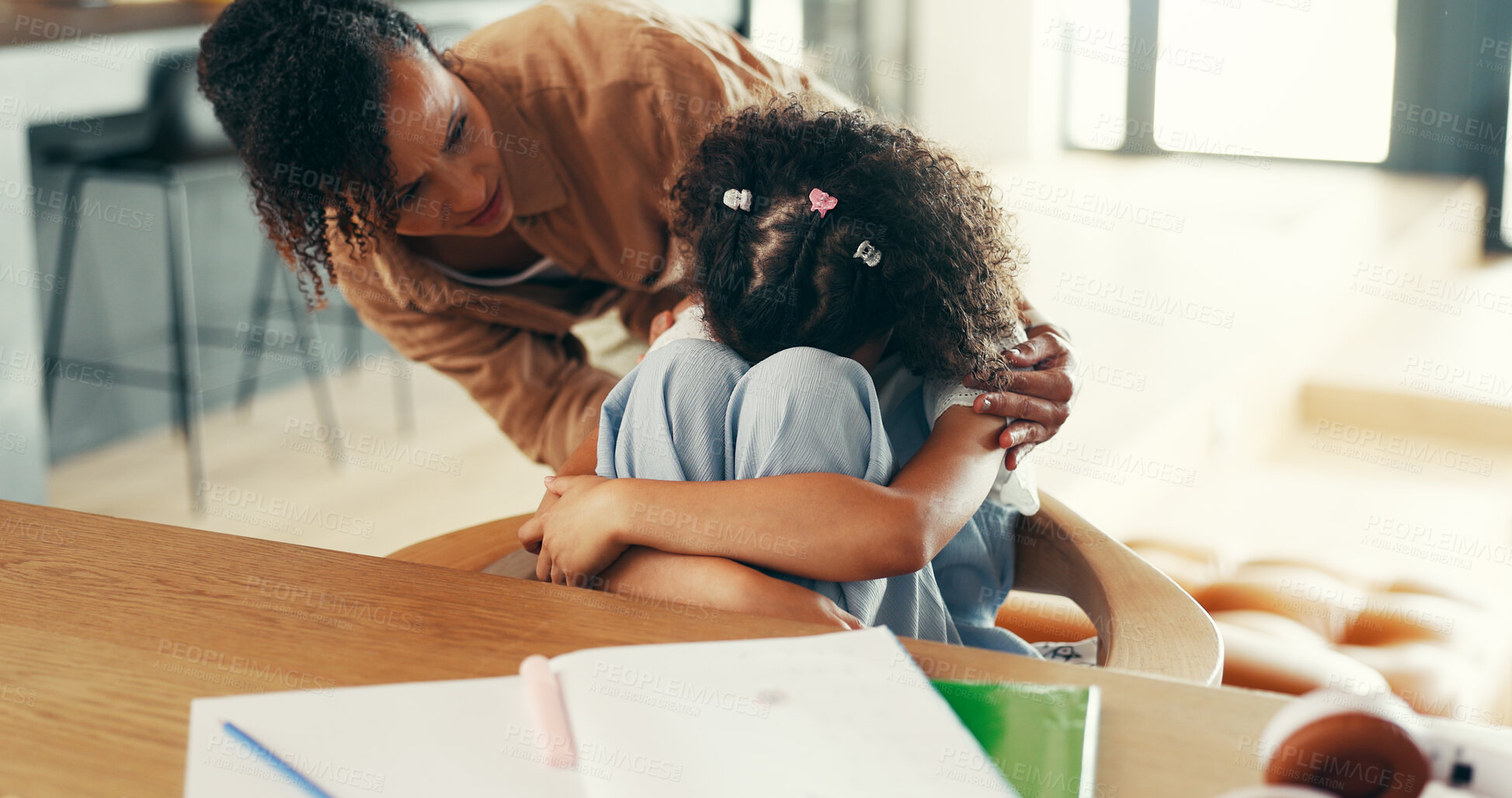 Buy stock photo Mom, girl and sad with hug, homework and support for learning disability with comfort at apartment. People, mother and daughter with embrace for adhd, education and console child in family house