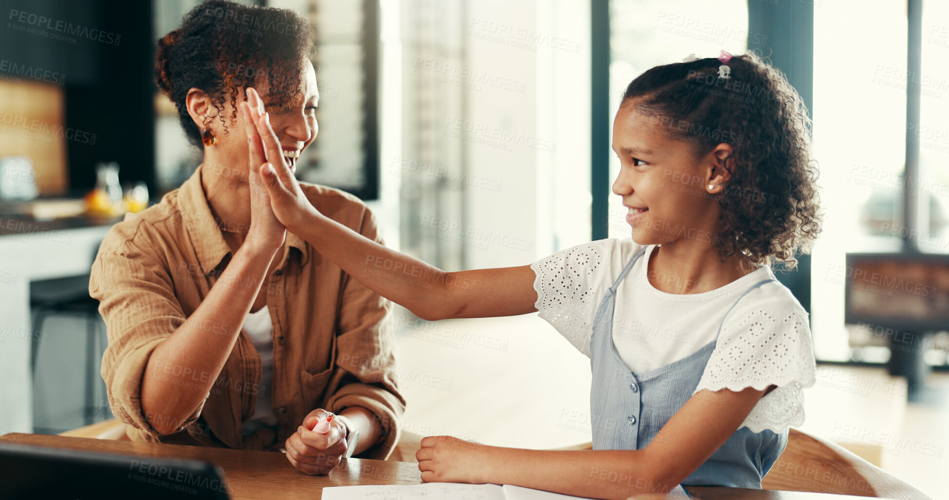 Buy stock photo Girl, mom and high five with education, homework and happy for solution, goals and support in house. People, mother and daughter with cheers, celebration and scholarship with learning at family home