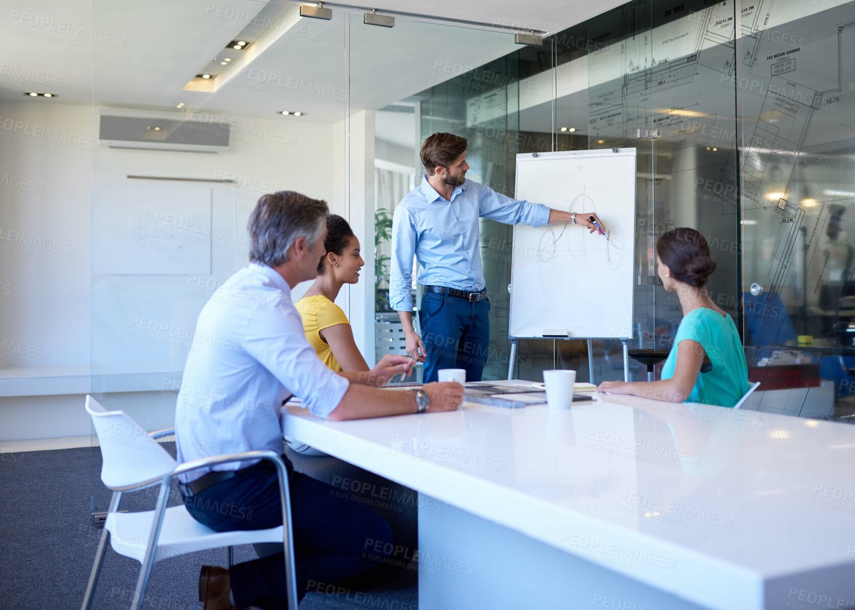 Buy stock photo Cropped shot of a handsome young man giving a business presentation