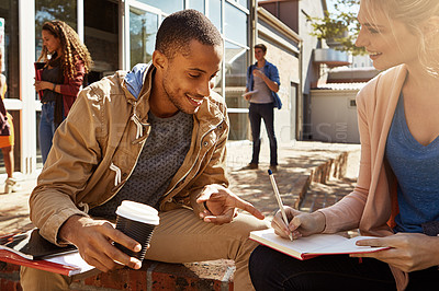 Buy stock photo Students, friends and writing in book outside together for class notes, exam study or education. University test, help or happy people learning for scholarship, diversity and research for assignment