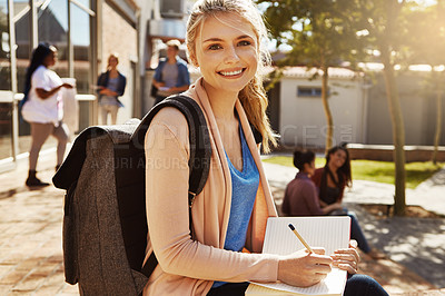 Buy stock photo Outdoor, smile and writing with woman in college for study, scholarship and school. Learning academy, happiness and knowledge with portrait of person on campus for university student, youth or future