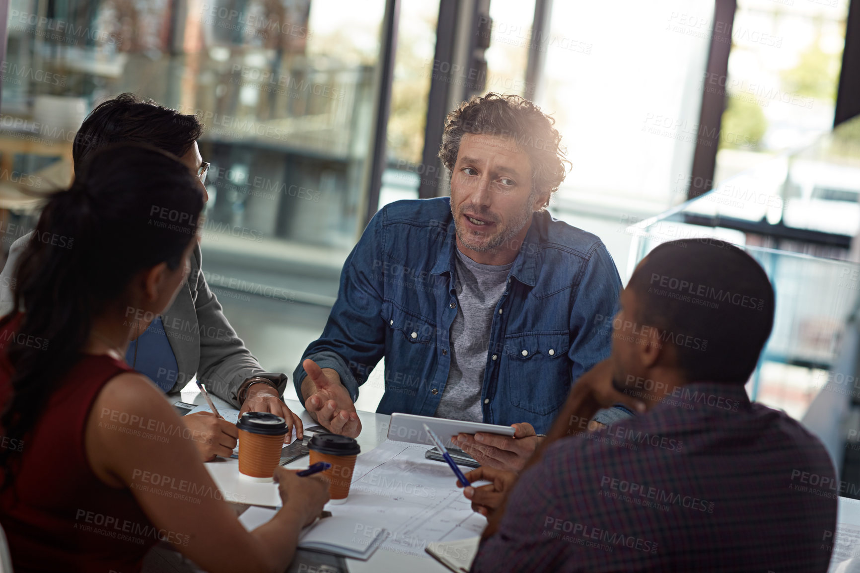 Buy stock photo Business people, tablet and diversity in collaboration, meeting or feedback as creative in office. Technology, group and discussion for team, review and communication in employee engagement or agency