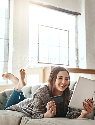 Buy stock photo Digital tablet, credit card and woman on a sofa for online shopping, ecommerce and payment while relaxing. Girl, couch and online banking from app, purchase and booking online in a living room