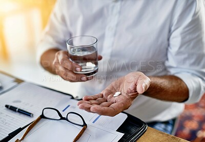 Buy stock photo Businessman, drinking water and hands with pills for medicine dosage, painkillers or medication. Migraine, paperwork or financial advisor with tablets, glass or closeup for headache and supplements