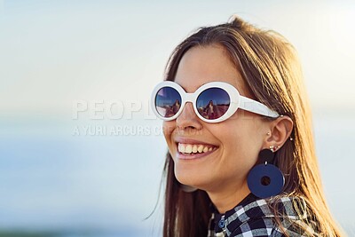 Buy stock photo Happy woman, sunglasses and freedom with fashion or jewelry in nature for holiday, weekend or outdoor vacation. Young, female person or tourist with smile in joy for stylish accessory or carefree day