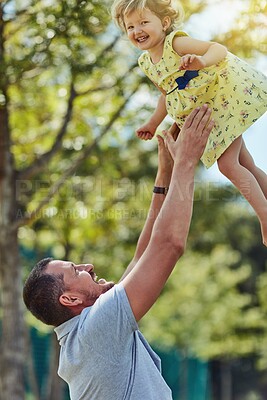 Buy stock photo Happy dad, daughter and lifting with nature for bonding, holiday or weekend together at park. Father, child or little girl with smile for love, care or support in air for fun playing or childhood