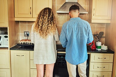 Buy stock photo Cooking, bonding and back of couple, kitchen and hungry for nutrition, healthy food or people in home. Relationship, woman and meal prep with man, romance and protein for breakfast, wellness or house