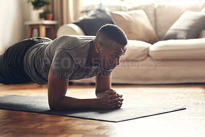 Buy stock photo Black man, plank and workout with mat for fitness, exercise or indoor practice on floor at home. African, male person or holding body weight for endurance, strong core or abdominal training at house