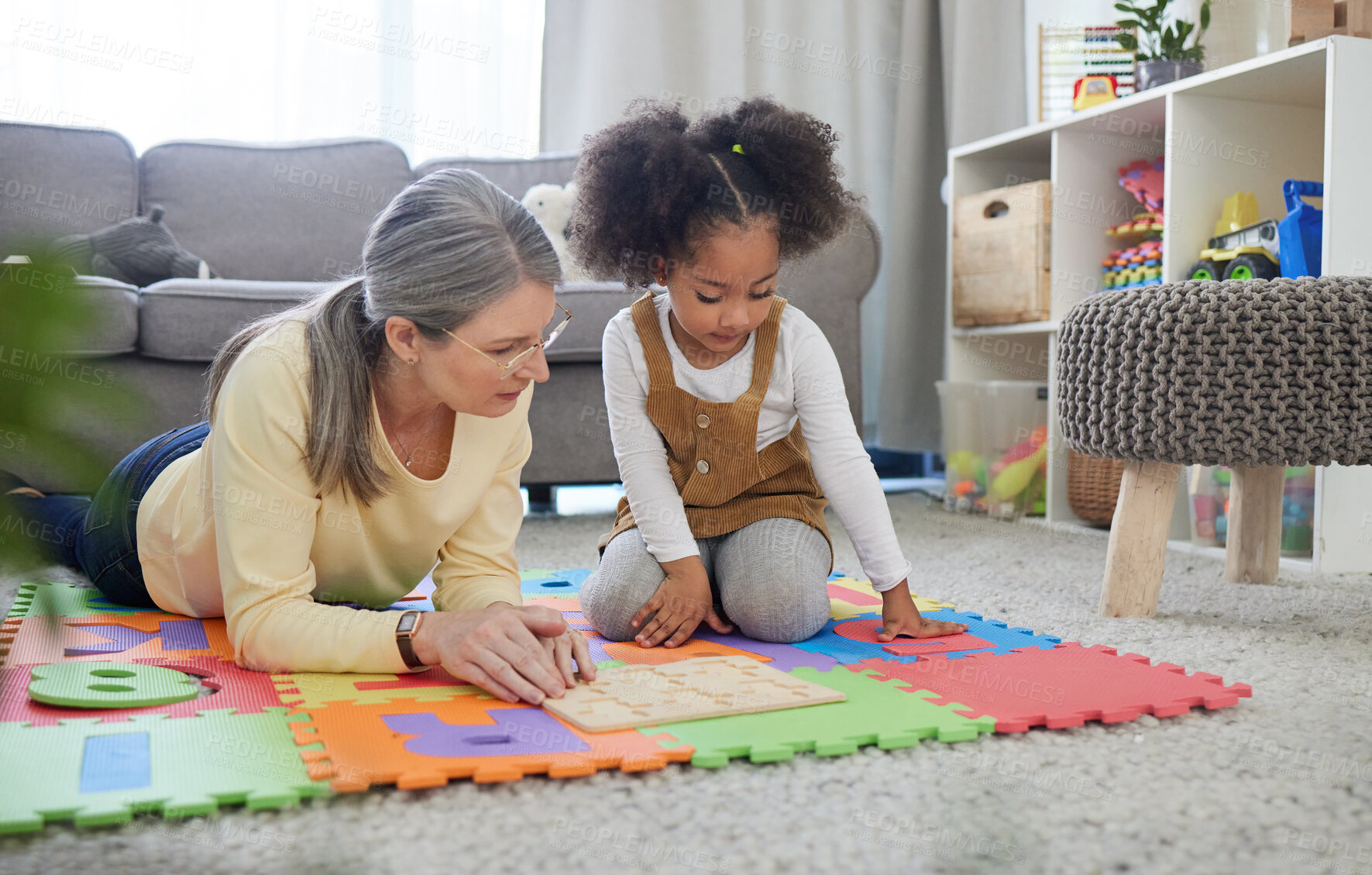 Buy stock photo Teacher, therapist and little girl with numbers for education, assisted learning or early childhood development. Woman, child or kid with toys for support, tutoring or occupational therapy at home