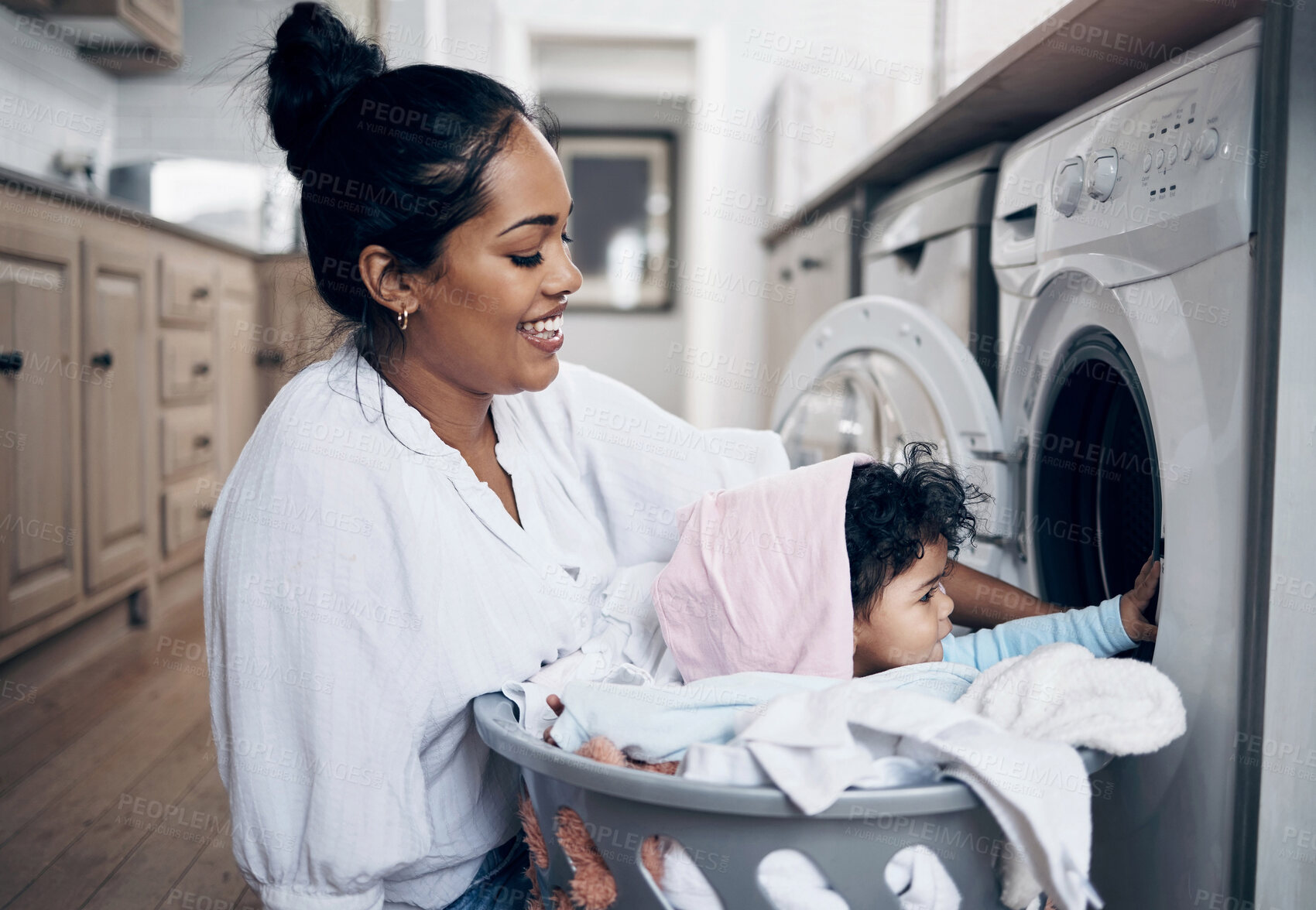 Buy stock photo Mom, baby and washing machine for laundry in home, helping mama and multitask with chores. Mother, support daughter and housekeeping with child, playful cleaning and loading clothes in appliance