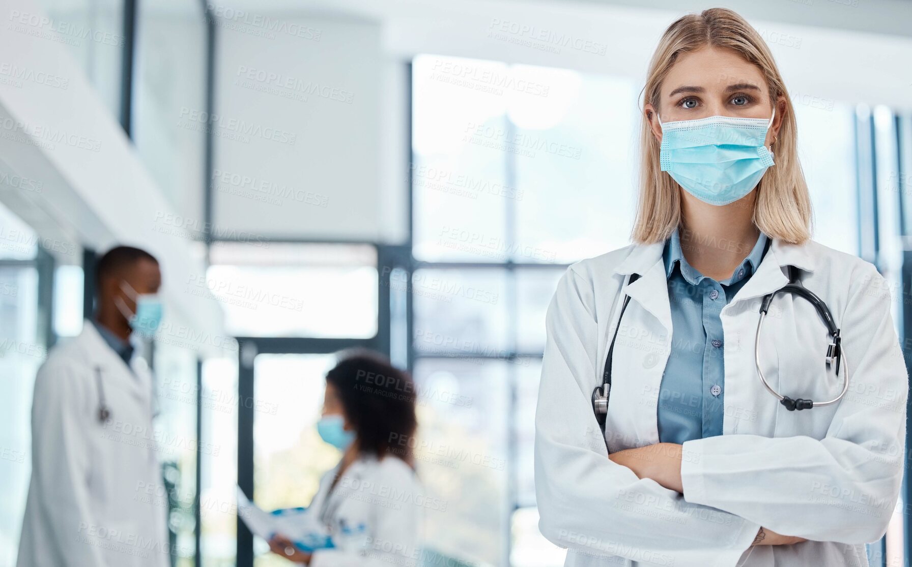 Buy stock photo Doctor, healthcare worker and medical professional with covid mask to protect from virus risk working in hospital. Portrait of an expert, proud and face of nurse in medicine career for service