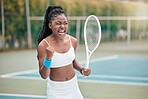 African american woman cheering after a tennis match. Young woman celebrating her success after a tennis match. Young girl playing a game of tennis on the court. Player holding a tennis racket