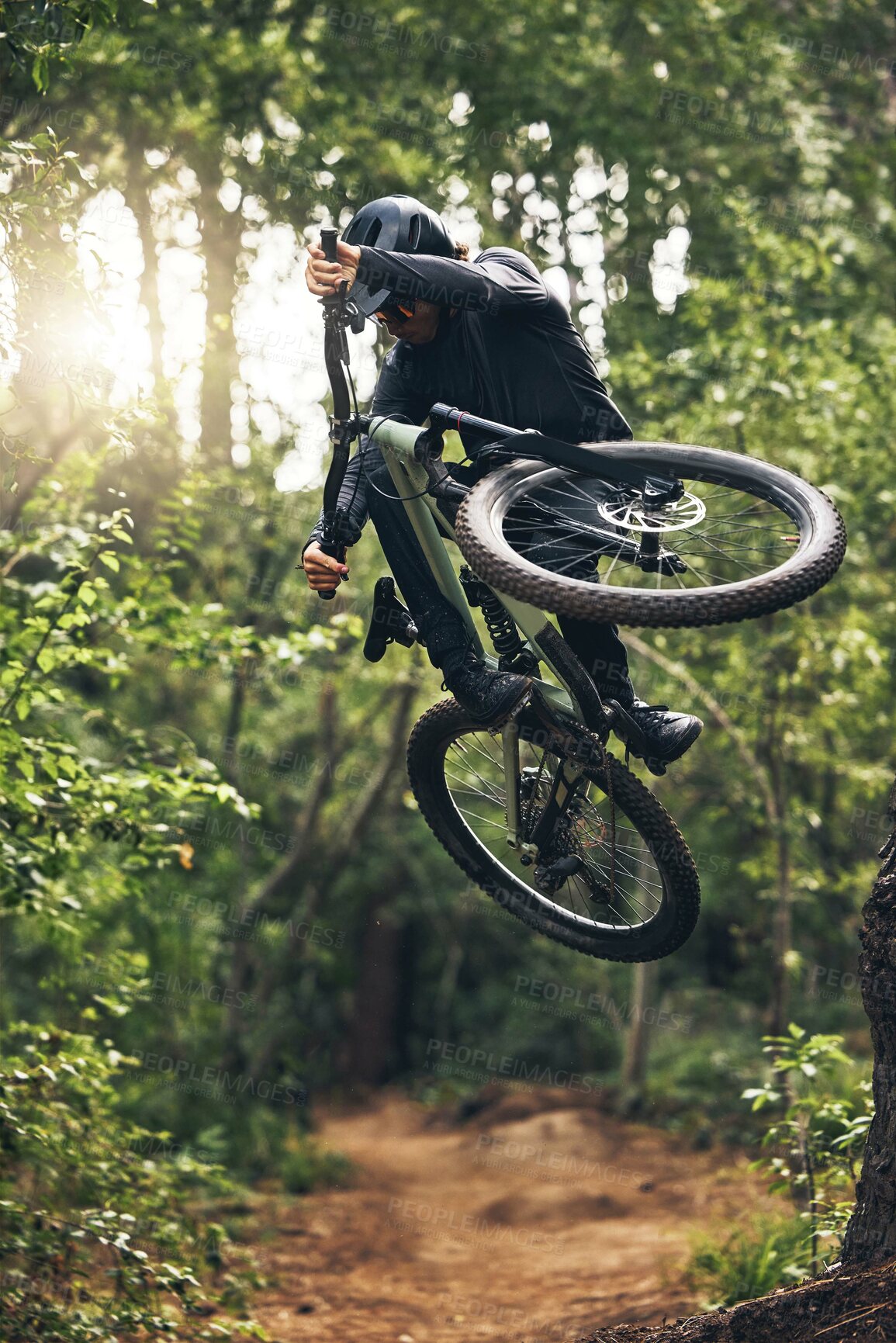 Buy stock photo Mountain biking, forest and freedom while on a bicycle and cycling outside in nature for exercise, adrenaline and skill. Fitness, health and an active man cycling on an outdoor adventure in Norway