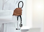 Doctor, stethoscope in hands and hospital healthcare professional in medical lab coat for patient checkup, health exam and breathing test. Cardiology wellness, black man clinic worker and leadership 