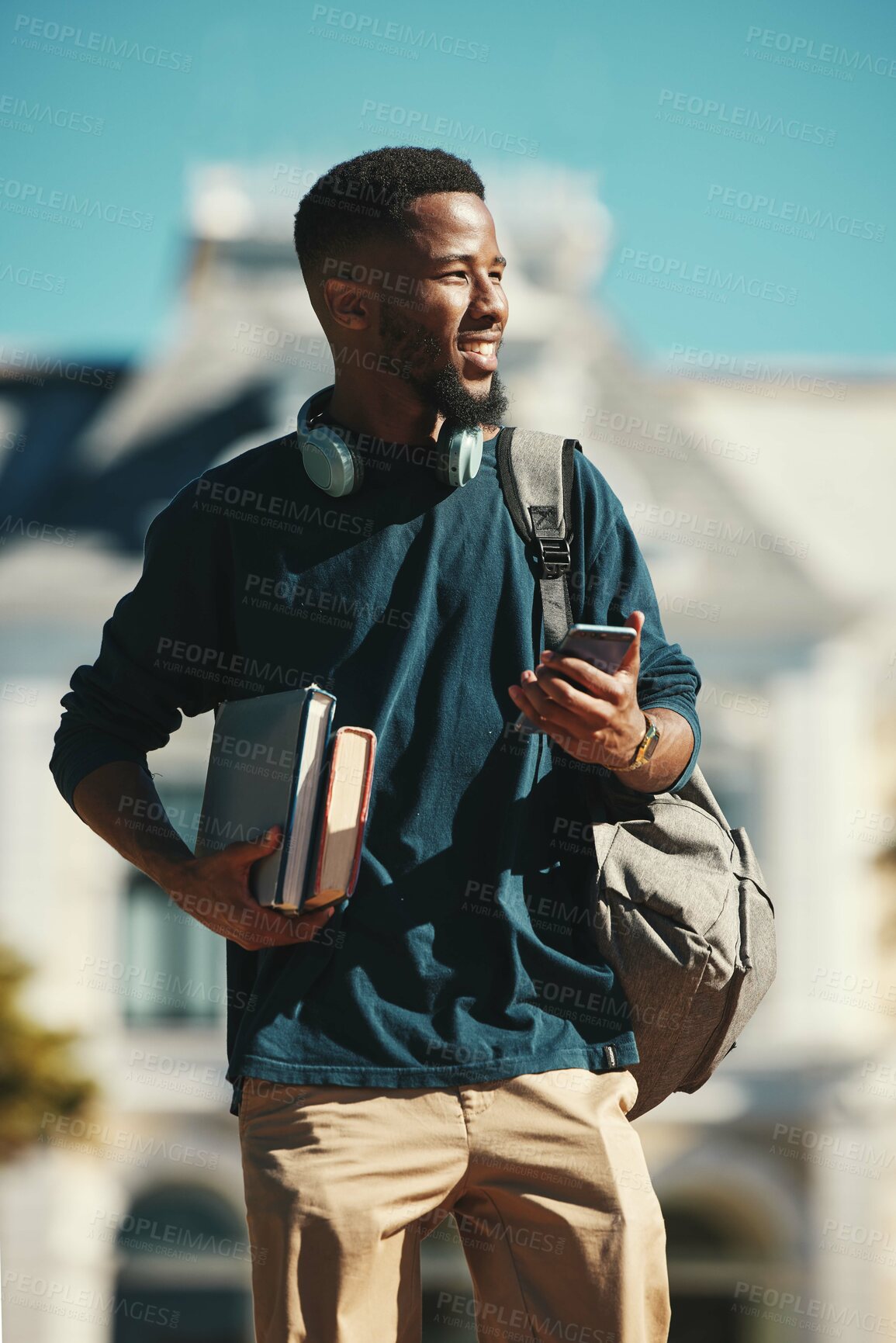 Buy stock photo Student, phone and happy on college, university and school campus with bag, textbook and smile outdoor. Black man, scholarship and education with lecture schedule online and happy with exam result