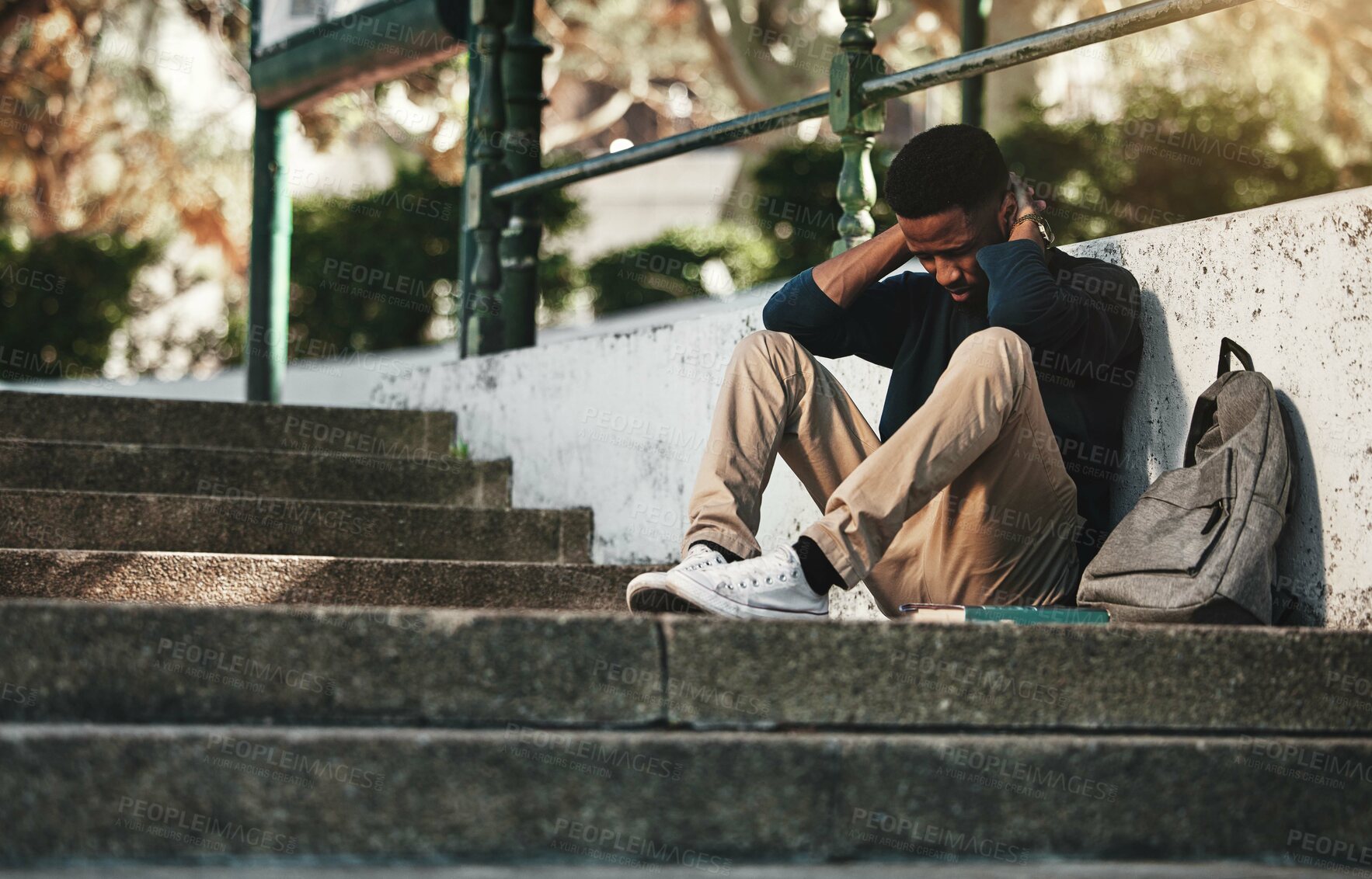 Buy stock photo Mental health, depression and anxiety with student on stairs with backpack for failure, fear and mistake. Sad, stress or bullying with black man on steps of college campus for frustrated or problem