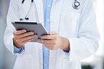 Healthcare, technology and hands of doctor with tablet online to review patient report, results and diagnosis. Medical worker with digital tech for insurance in hospital, clinic or health facility