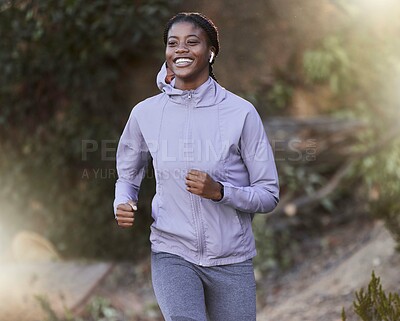 Buy stock photo Black woman, running and outdoor for exercise, training or fitness for health, wellness or smile. Jamaican female, healthy athlete or runner in nature, workout or practice for power, energy or cardio