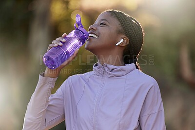 Buy stock photo Exercise, black woman and drinking water for fitness, wellness and health outdoor to relax. Sports, young female Nigerian and athlete hydration, liquid for break and training for workout and earbuds.