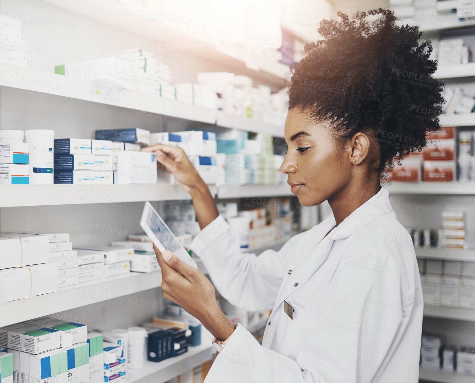 Buy stock photo Black woman, tablet and pharmacist at shelf for stock take, storage or check inventory. Tech, pharmacy and medical worker with drugs for online prescription order, information or healthcare at store