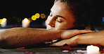 Woman, relax or zen with pool at night for vacation, holiday or getaway at luxury resort. Female person, rest or sleeping with relaxation in hot tub for stress relief or beauty spa treatment