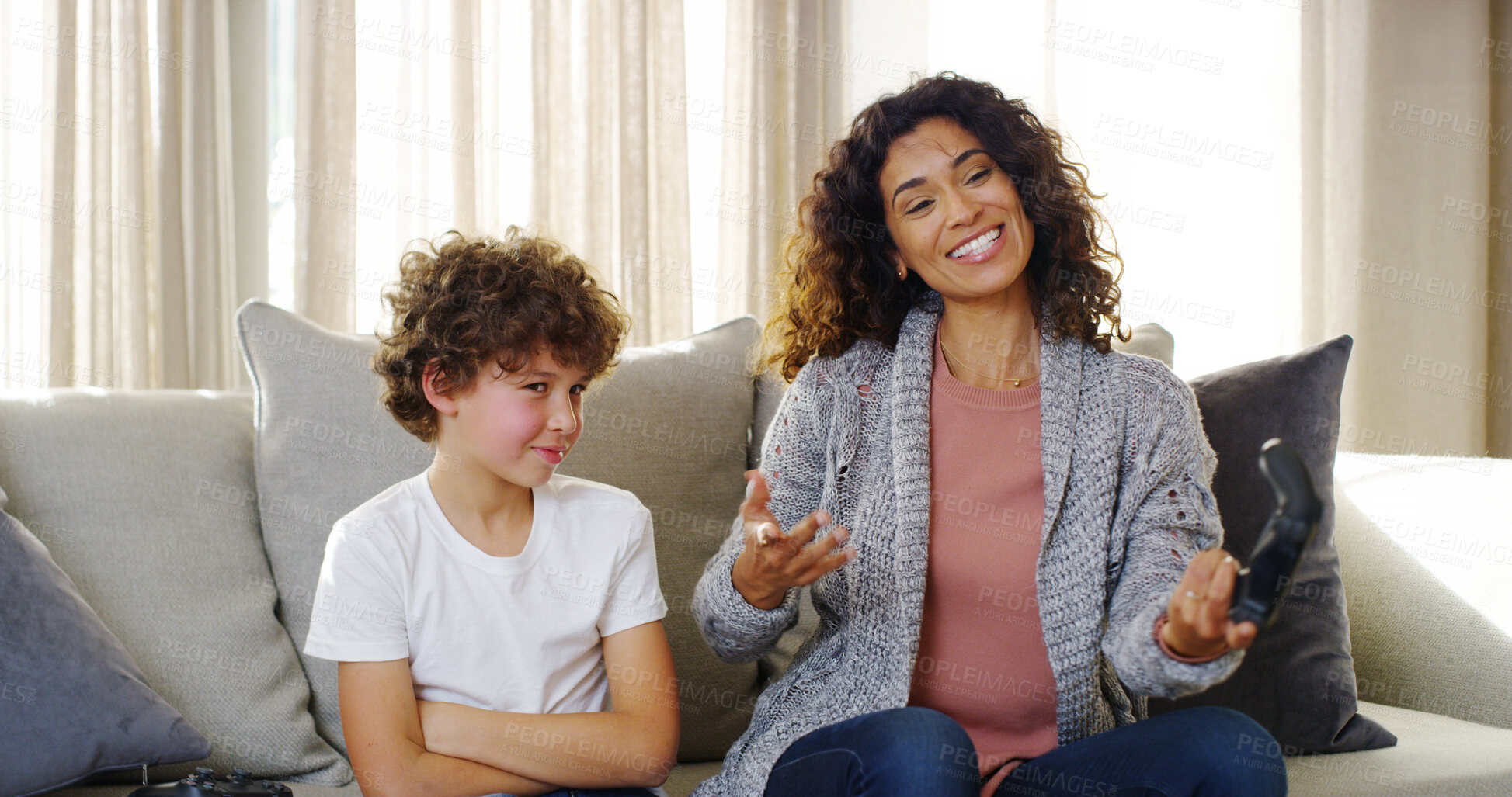 Buy stock photo Mother, boy and smile with joystick for video games on couch for winning or losing match at home. Apartment, people and playful as parent with kid for streaming esports, tournament or challenge