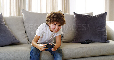 Buy stock photo Gaming, home and child with controller, smile and playing with subscription in living room and gamer. Happy, boy and fun with tech in lounge, relax and kid with console, joy and online in house