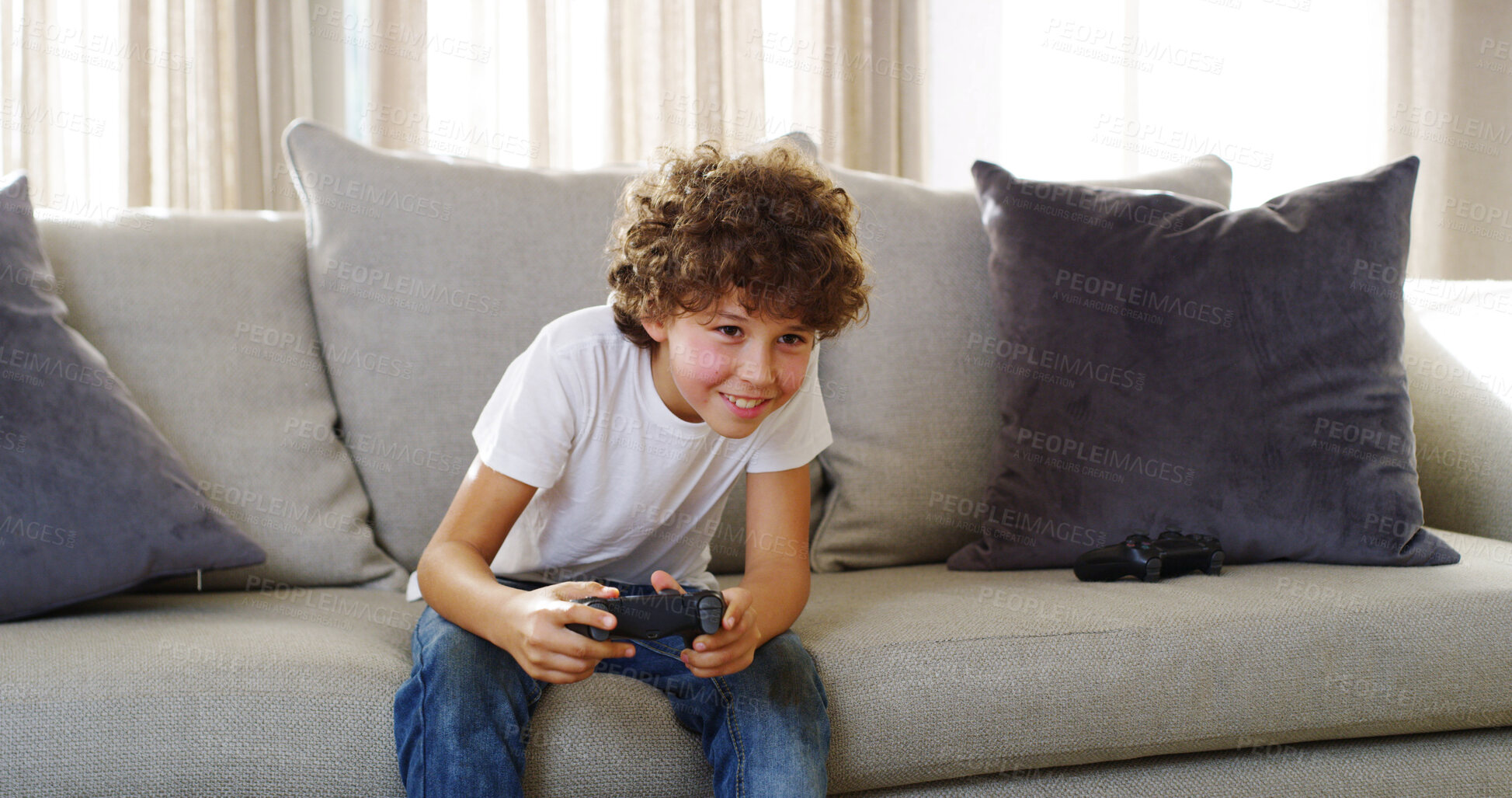 Buy stock photo Gaming, home and child with controller, smile and playing with subscription in living room and gamer. Happy, boy and fun with tech in lounge, relax and kid with console, joy and online in house