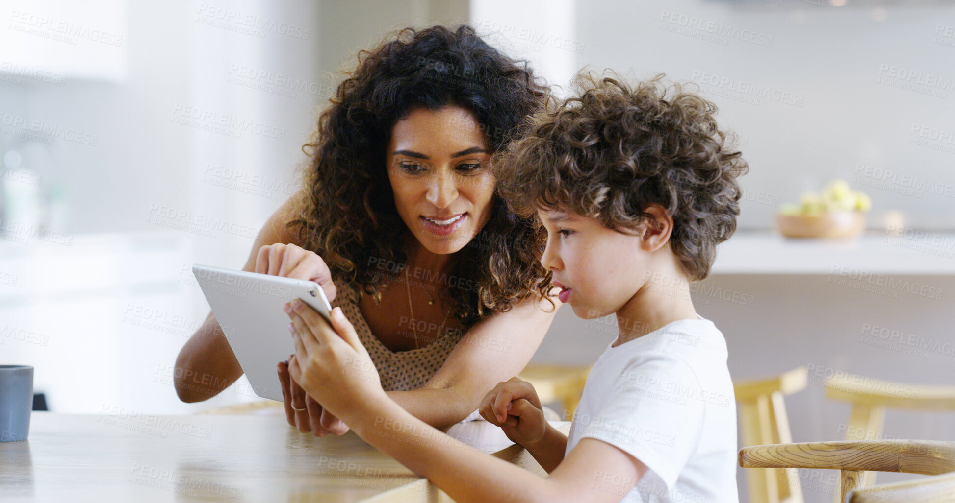 Buy stock photo Woman, tablet and help boy for education, elearning and studying for future and knowledge. Mother, child and kitchen for teaching, homework or support for home school or development with assessment