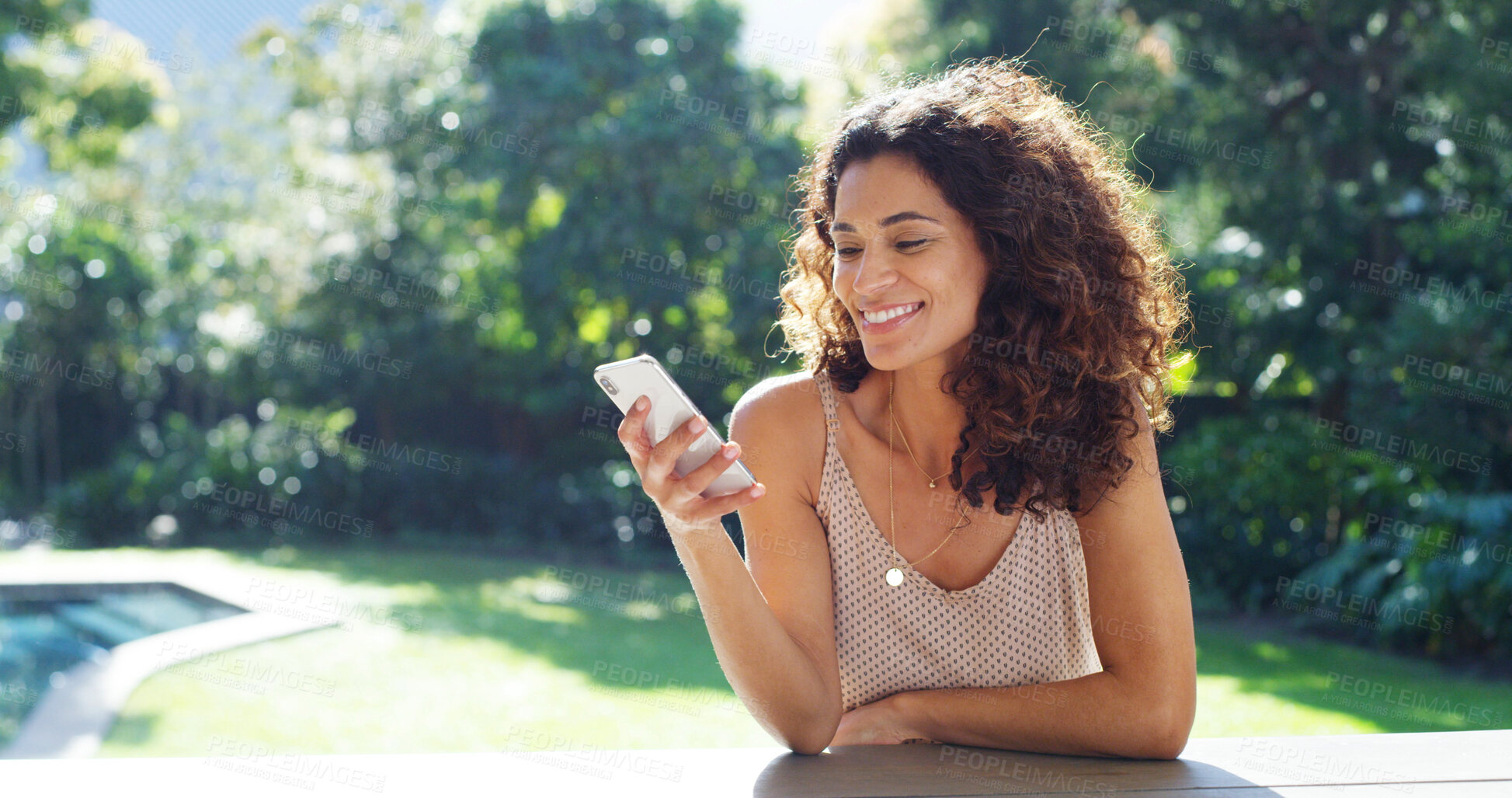 Buy stock photo Phone, relax and smile with woman in garden of home for app, communication or social media. Break, reading and summer with happy person outdoor for connectivity, mobile download or status update