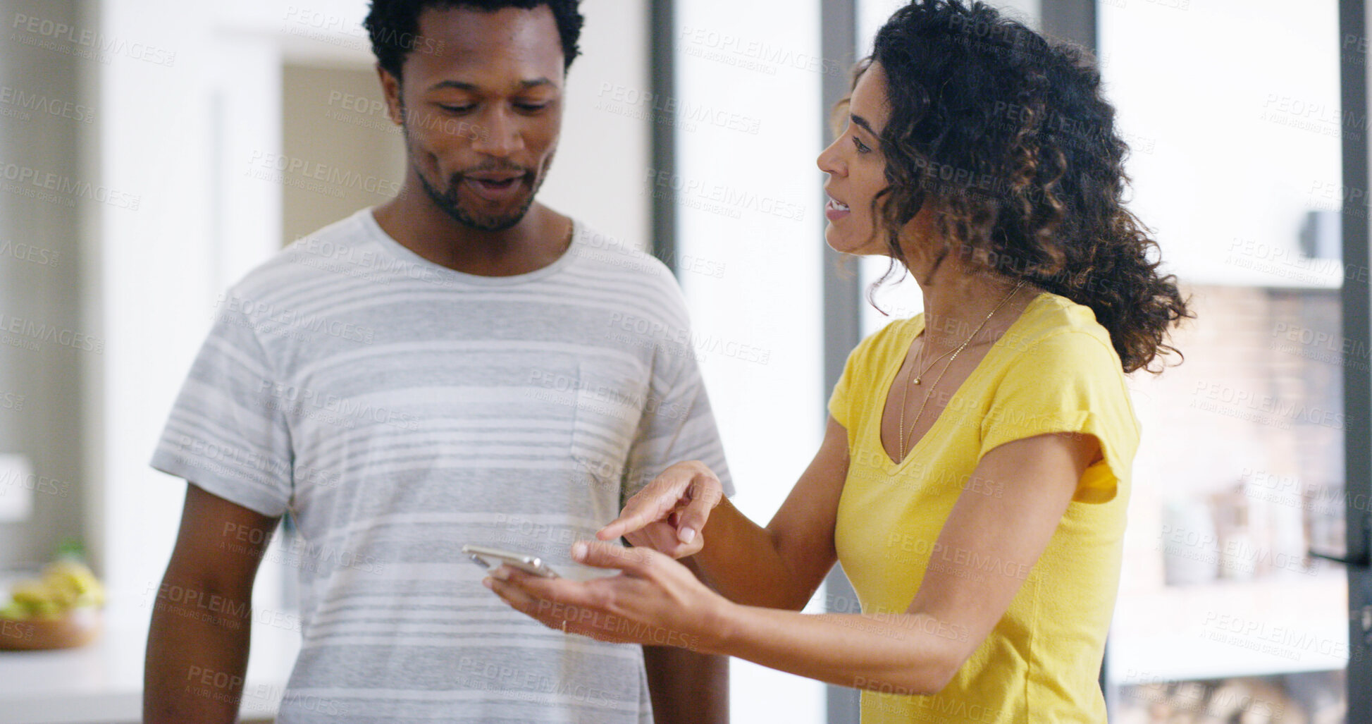 Buy stock photo Phone, conversation and couple in home with online communication, notification or contact together. Technology, bonding and interracial man and woman talking with research on cellphone in apartment.