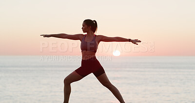 Buy stock photo Sunset, girl and stretching with yoga at ocean of spiritual fitness, mindfulness and holistic healing. Active woman, warrior pose and nature with pilates zen, mental health and balance for wellness 