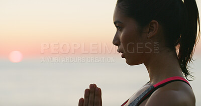 Buy stock photo Woman, sunset and meditation with yoga at ocean for spiritual fitness, mindfulness and holistic healing. Athlete girl, mindset and pilates peace with mental health, self care and wellness with space