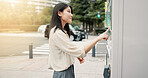 Asian woman, vending machine or city with choice for selection, pick or snack on sidewalk. Japan, female person or local shopper with self service station, vendor or shop dispenser for option in town